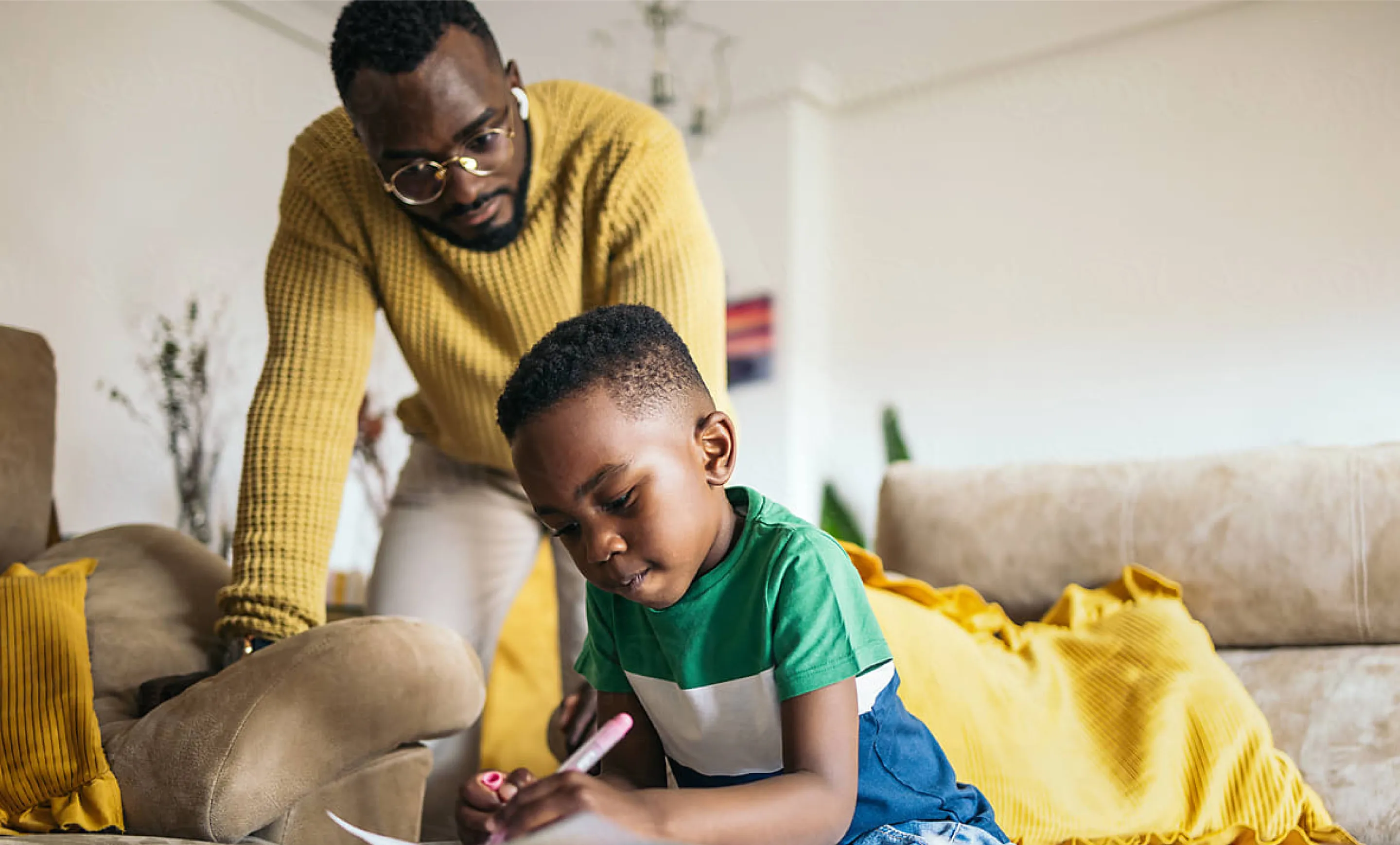 a man and a boy playing with a toy